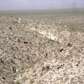 The old remnant of a road ends here on the crest of the hill at a small mine shaft; I continue walking cross-country