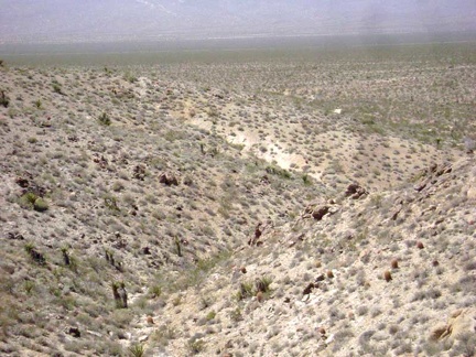 The old remnant of a road ends here on the crest of the hill at a small mine shaft; I continue walking cross-country