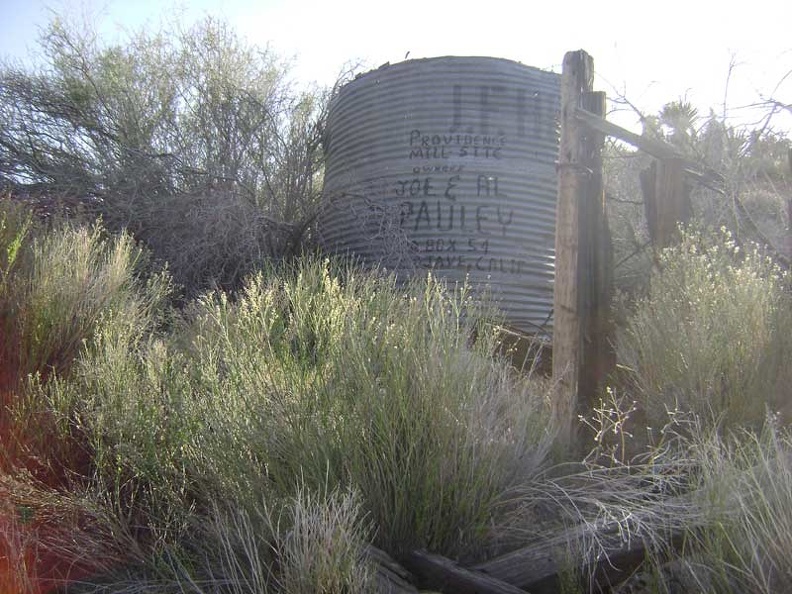 Close-up of the old water tank and the painted-on names of its owners