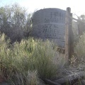 Close-up of the old water tank and the painted-on names of its owners