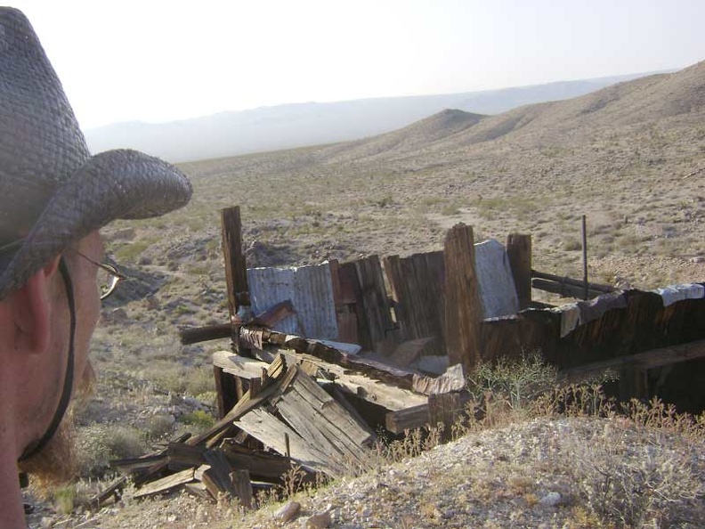 I look down at the remains of a structure up at the mine site