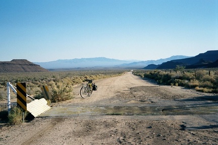 Just beyond the end of the pavement, Black Canyon Road crosses a cattleguard