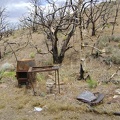 Debris at the burned Winkler's Cabin site at the end of Bluejay Mine Road, Mojave National Preserve