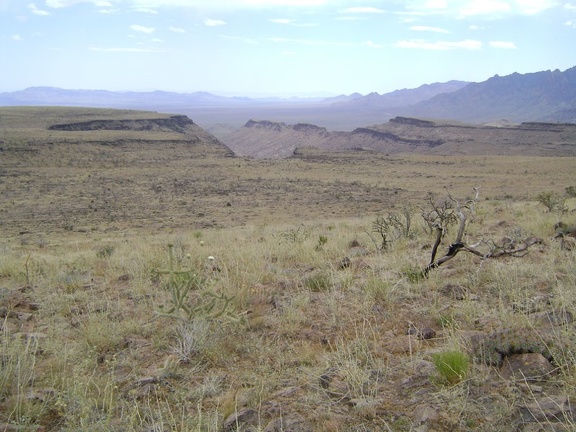 Looking southwest across Wild Horse Mesa, the plateau drops off into the southern end of Beecher Canyon