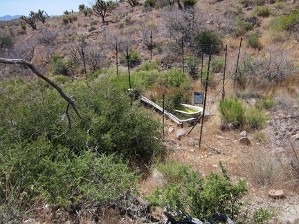  I check my GPS and climb over a small hill to reach Bathtub Spring; there it is, in a wire cage!