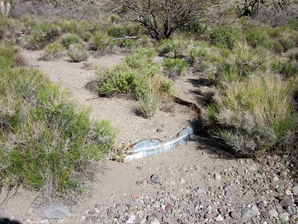 I notice what looks like an old metal cistern buried in the sands of Willow Wash
