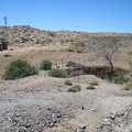 I stand on a small tailings pile at Gold Valley Mine and look down at an old pit