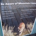 A poster at Hole-in-the-Wall visitor centre warns of possible mountain lions in the Mid Hills area, where I'm camping