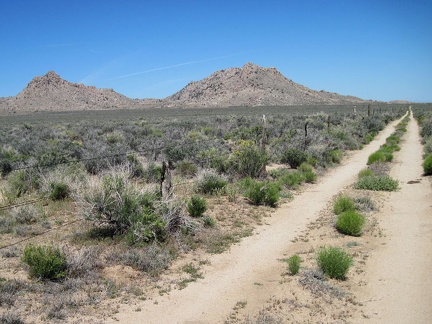 Woods Wash Road makes a two-mile U-shaped detour around the government property