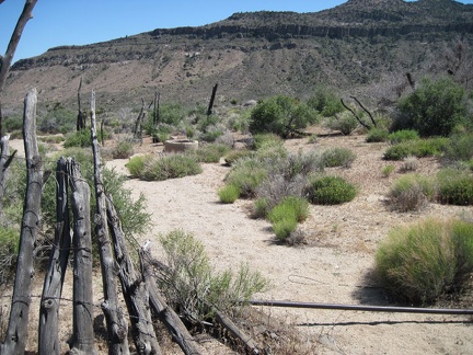I pass an abandoned corral, with the Woods Mountains in the background