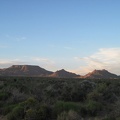 Table Mountain and Twin Buttes take on a postcard-photo aura as I ride slowly up Black Canyon Road