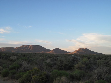 Table Mountain and Twin Buttes take on a postcard-photo aura as I ride slowly up Black Canyon Road