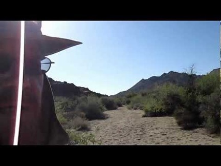 The sun gets lower as I hike back up the wash toward my tent near Twin Buttes