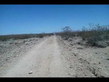 Riding across Woods Wash Valley, cattle-grazing land, I come across another of several water tanks