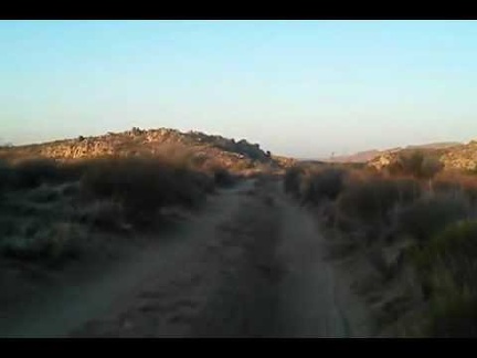 Riding the bicycle back to camp on Woods Wash Road