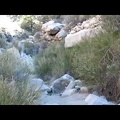 I encounter a small dry waterfall in the canyon