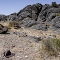 Rusted tin can and rock outcrop