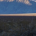 The final rays of the day swipe across the valley in a few long brush strokes