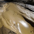 A post-rain mud flow begins to dry