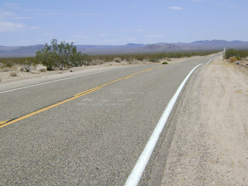The first 10 miles of Kelbaker Road upon leaving Baker is long and straight and rises from 925 feet to 2000 feet