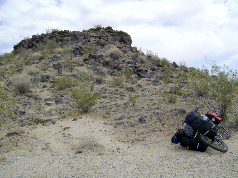 I park the 10-ton bike at the edge of the lava flow and go for a walk up the hill