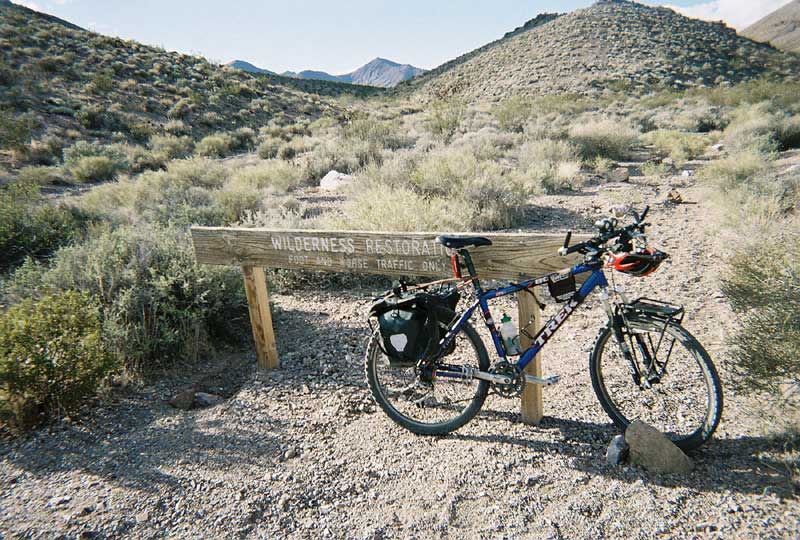 I lock my bike to a wilderness sign along Chloride Cliff Road and go for a short walk toward the old Keane Spring