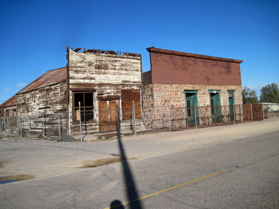 These two old commercial buildings in Daggett have been fenced off, perhaps with the hope of preserving them