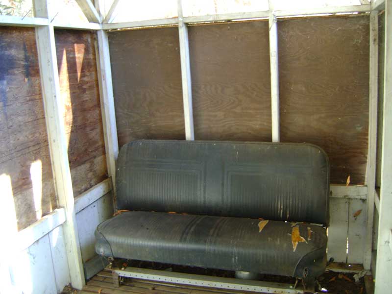 Away from the stream of water in Pacheco Camp's shower shed sits an old car seat