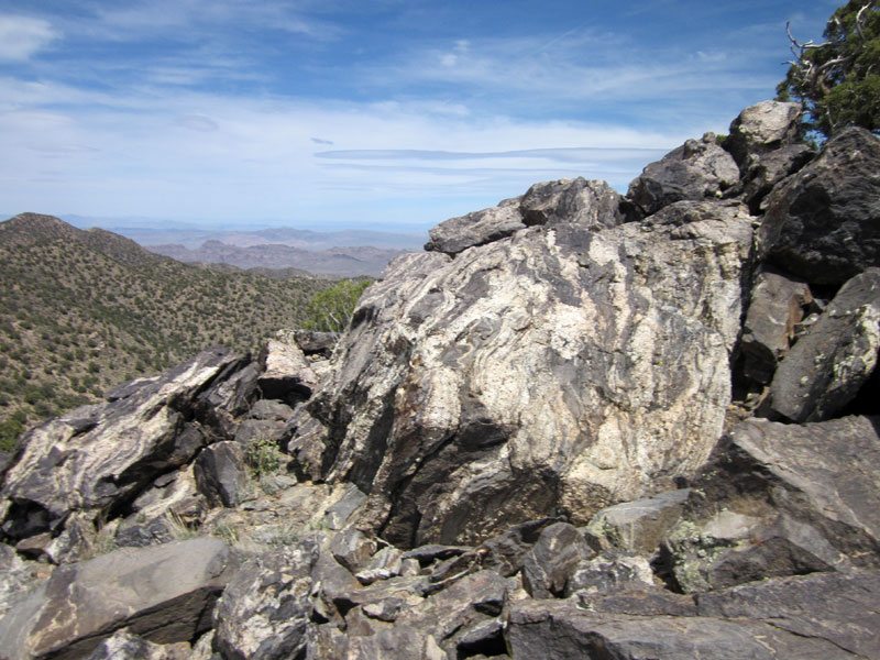 A pile of rocks sits upon McCullough Mountains unnamed peak 6557
