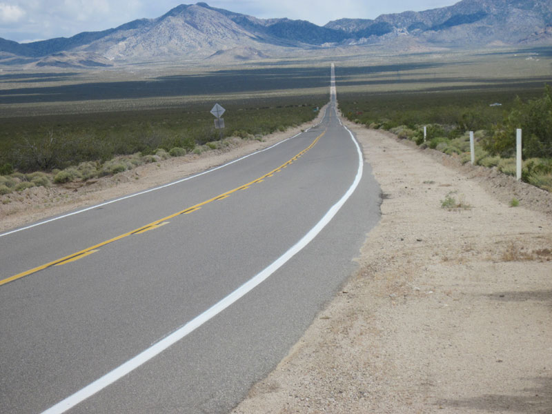 I pause at the end of Morning Star Mine Road to look east up Ivanpah Road into the New York Mountains