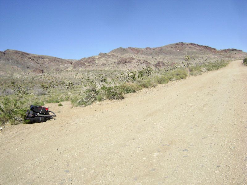 As I pedal my way gently up Ivanpah Road on the compromised 10-ton bike, I stop briefly at the little road to Bathtub Spring